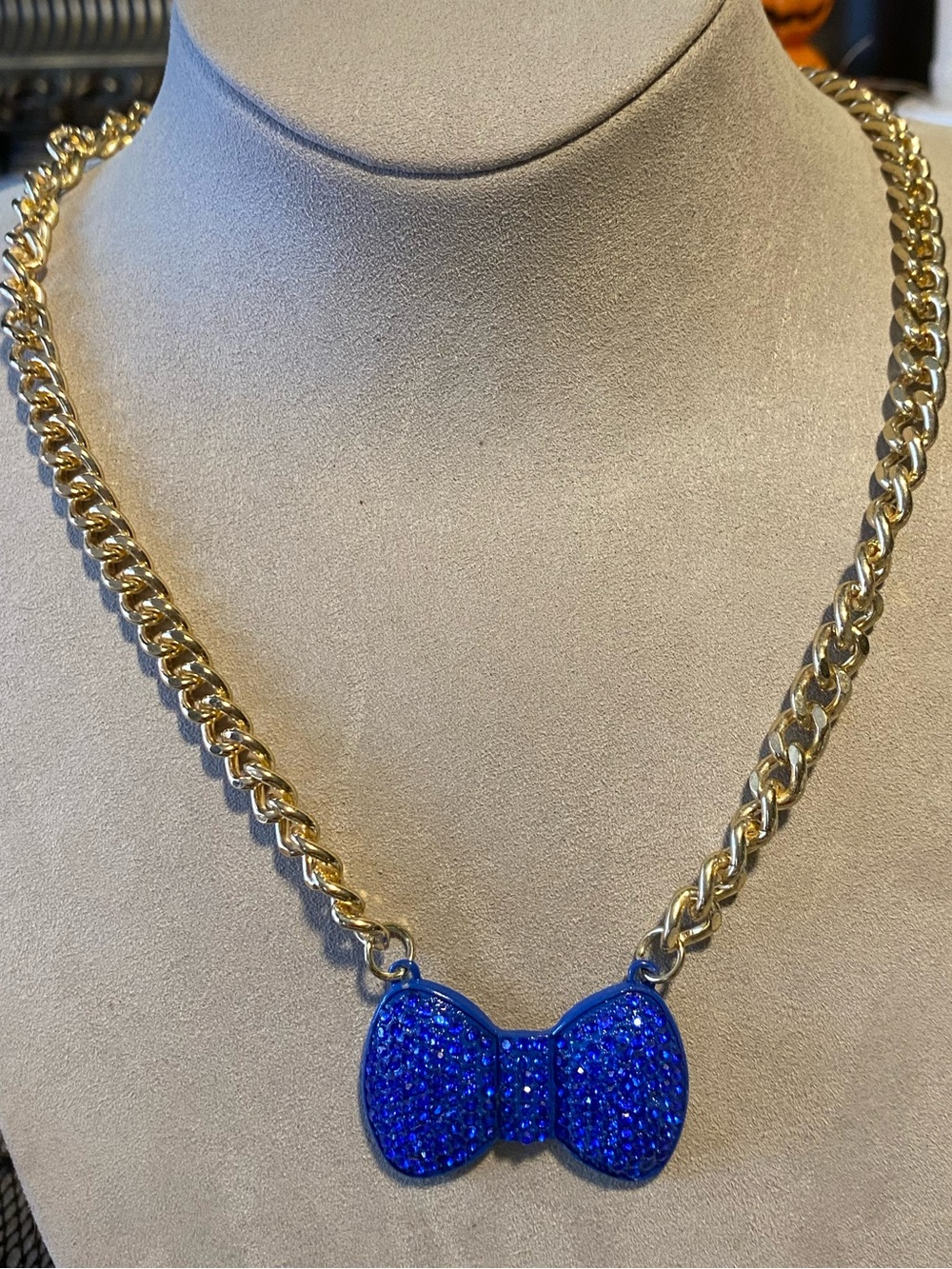 Gold Chain Necklace with Chunky Blue Bow Pendant